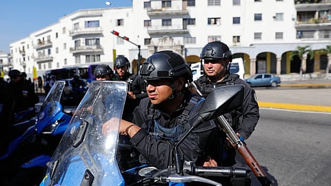 Police patrol in downtown Caracas, Venezuela, Monday, Jan. 5, 2026