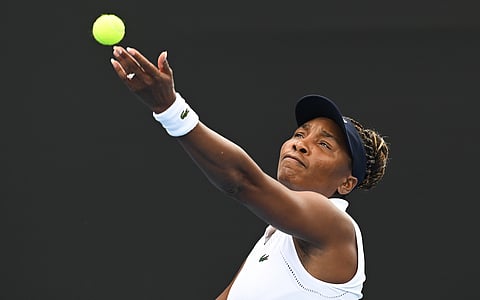 Venus Williams of the U.S. prepares to serve to Magda Linette of Poland during her singles match ASB Classic Women's Tennis Tournament in Auckland.