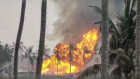 Smoke and flames billow after a gas pipeline leak at a well, operated by ONGC's production contractor Deep Industries Ltd, triggered a fire, in Dr B R Ambedkar Konaseema district, Andhra Pradesh, Monday, Jan. 5, 2026. 