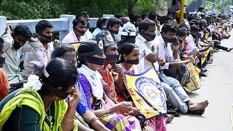 Teachers protesting with their mouths gagged in Chennai.
