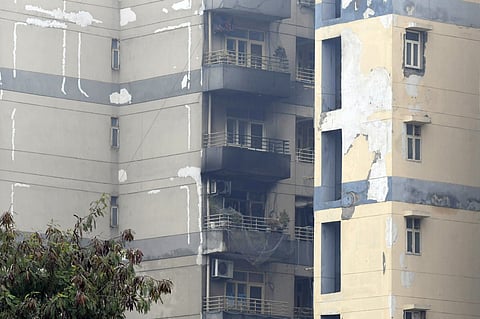 Three members of a family die after a fire breaks out at Delhi Metro Rail Corporation (DMRC) staff quarters near Majlis Park metro station, in New Delhi on Tuesday.