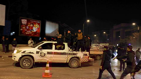 Members of Syrian government forces deploy on the streets as they take over the Achrafieh neighborhood from Kurdish fighters during ongoing clashes that erupted Tuesday in a contested area of the northern city of Aleppo, Syria, Thursday, Jan. 8, 2026.