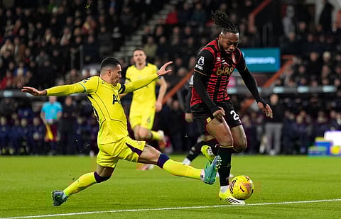 Tottenham Hotspur's Pedro Porro, left, challenges Bournemouth's Antoine Semenyo during the English Premier League soccer match between Bournemouth and Tottenham Hotspur in Bournemouth, England, Wednesday Jan. 7, 2026.