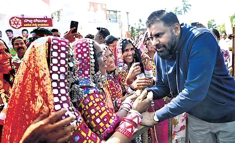 Deputy CM Pawan Kalyan interacts with women from Banjara community.