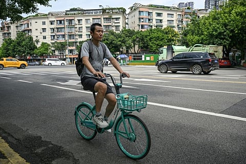 Author Hu Anyan was one of the millions of delivery drivers powering China's retail giants before his book brought him into the spotlight.