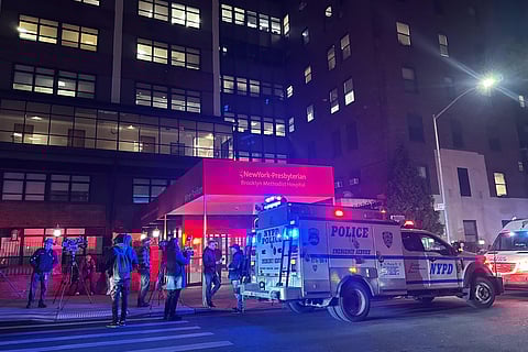 Police vehicles are parked outside NewYork-Presbyterian Brooklyn Methodist Hospital Thursday, Jan. 8, 2026, in Brooklyn, N.Y., after an officer shot a man wielding a sharp object inside.