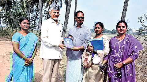 CM Nara Chandrababu Naidu distributing Pattadar Passbook to a farmer during a programme conducted at Rayavaram in Mandapeta constituency on Friday.