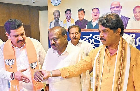 State BJP president BY Vijayendra, Union Minister HD Kumaraswamy and LoP in Assembly R Ashoka at a press meet in Benglauru on Saturday.