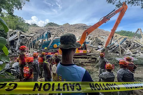 Search and rescue teams look for people after a landslide at the landfill in Barangay Binaliw, Cebu City on January 9, 2026.