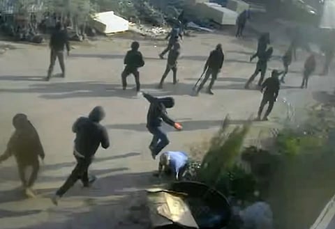 Video of masked men beating a Palestinian in occupied West Bank