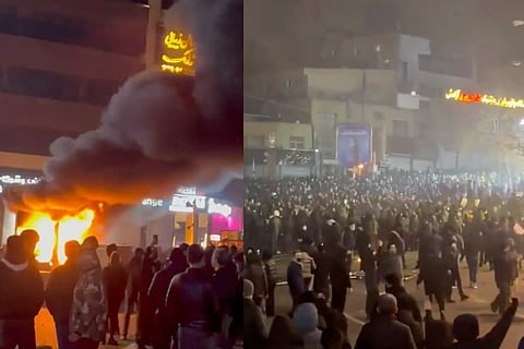 In this frame grab from video provided  by The Associated Press shows a fire as people protest in Tehran, Iran, Friday, Jan. 9, 2026.