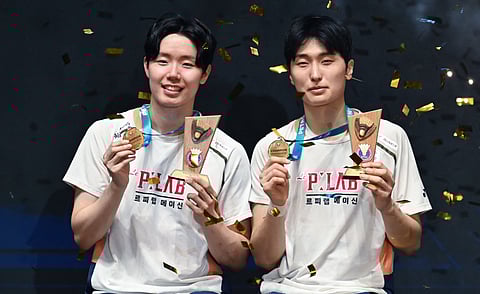 Korea’s Seo Seung Jae (L) and Kim Won Ho during the awards ceremony at the Malaysia Open  tournament in Kuala Lumpur on Sunday
