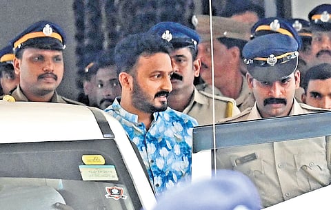 Police bring Palakkad MLA Rahul Mamkootathil out of the AR Camp 
in Pathanamthitta 