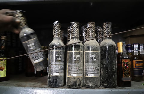 Dust-covered liquor bottles with "Manufactured in 2021" stickers were seen at a TASMAC retail outlet in Coimbatore on Sunday, as the administration brought to sale stock stored in godowns for over four years.