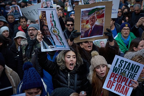 People take part in a demonstration to support mass rallies denouncing the Islamic republic in Iran in Paris on January 11, 2026.