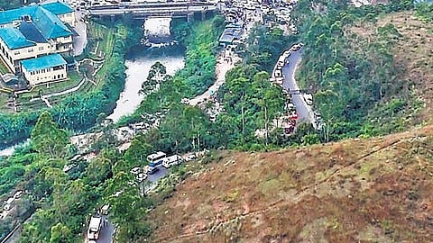 An aerial view of a gridlocked Munnar road