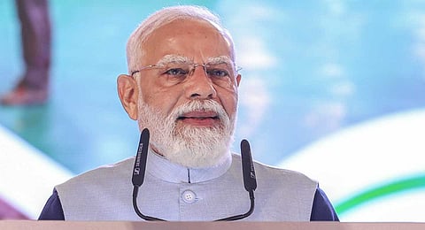In this image received on Jan. 11, 2026, Prime Minister Narendra Modi addresses the gathering during the inaugural ceremony of the Vibrant Gujarat Regional Conferences (VGRC), in Rajkot. 