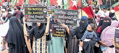 People protest against the Kogilu demolition at Freedom Park in Bengaluru on Monday.