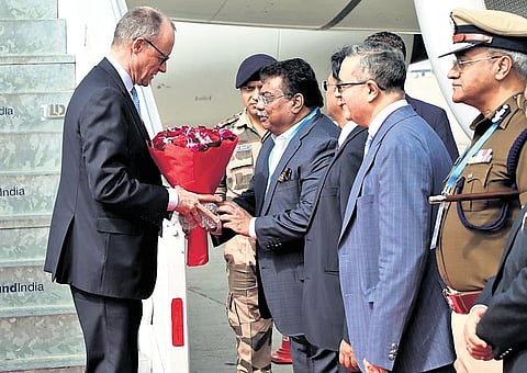 Minister for Large and Medium Industries MB Patil welcomes German Chancellor Friedrich Merz at the Kempegowda International Airport in Bengaluru on Tuesday. Merz reached Benglauru from Ahmedabad  