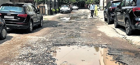 A badly damaged road.