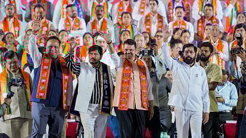 Maharashtra Chief Minister Devendra Fadnavis, Deputy Chief Minister Ekanth Shinde, Republican Party of India (RPI) Chief Ramdas Athawale and others during a rally for the BMC elections in Mumbai, Monday, Jan. 12, 2026.