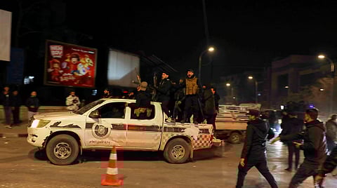 Members of Syrian government forces deploy on the streets as they take over the Achrafieh neighborhood from Kurdish fighters during ongoing clashes that erupted Tuesday in a contested area of the northern city of Aleppo, Syria, Thursday, Jan. 8, 2026.