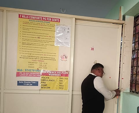 An official seals a paying guest accomodation in Bengaluru South City Corporation limits.