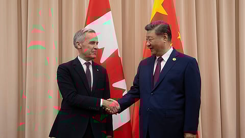 FILE - Canadian Prime Minister Mark Carney, left, shakes hands with Chinese President Xi Jinping at the start of a meeting in Gyeongju, South Korea, Oct. 31, 2025. 