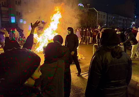 In this photo obtained by The Associated Press, Iranians attend an anti-government protest in Tehran, Iran, Friday, Jan. 9, 2026.