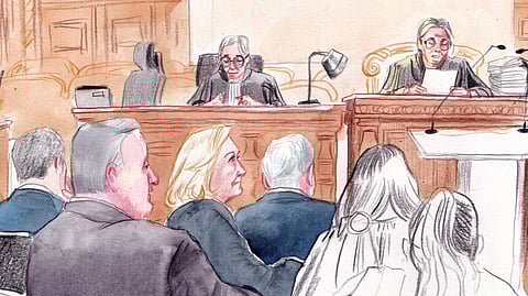 In this courtroom sketch, French far-right leader Marine Le Pen, center left, appears in court with other members of the far-right National Rally party to appeal an embezzlement conviction that risks affecting her 2027 presidential ambitions, Tuesday, Jan. 13, 2026, in Paris.