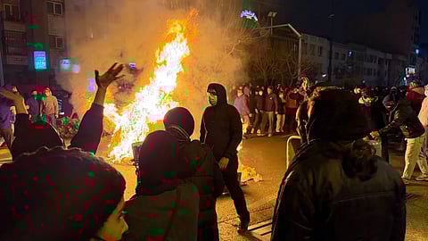 In this photo obtained by The Associated Press, Iranians attend an anti-government protest in Tehran, Iran, Friday, Jan. 9, 2026. 