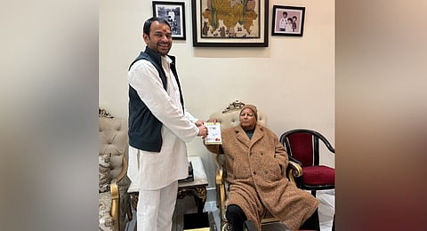 RJD president Lalu Prasad Yadav with son Tej Pratap Yadav.
