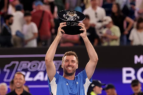 Jordan Smith celebrates with the trophy