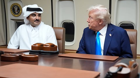President Donald Trump, right, meets with Emir of Qatar Sheikh Tamim bin Hamad al-Thani aboard Air Force One at Al Udeid Air Base in Doha, Qatar, Saturday, Oct. 25, 2025.