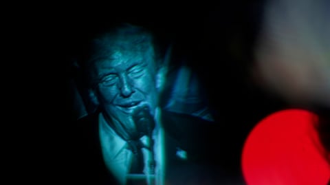 Seen through a viewfinder, US President Donald Trump speaks at the Detroit Economic Club on Tuesday, Jan. 13, 2026, in Detroit.