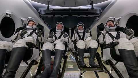Roscosmos cosmonaut Oleg Platonov, left, NASA astronauts Mike Fincke, Zena Cardman, and JAXA (Japan Aerospace Exploration Agency) astronaut Kimiya Yui are seen inside the SpaceX Dragon Endeavour spacecraft onboard the SpaceX recovery ship SHANNON shortly after having landed in the Pacific Ocean off the coast of Long Beach, Calif., Thursday, Jan. 15, 2026.
