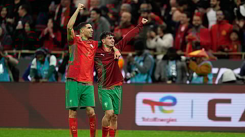 Morocco's Achraf Hakimi, left, and Brahim Abdelkader Díaz celebrate after winning the penalty shootout during the Africa Cup of Nations semi-final match between Nigeria and Morocco in Rabat, Morocco, Wednesday, Jan. 14, 2026. 