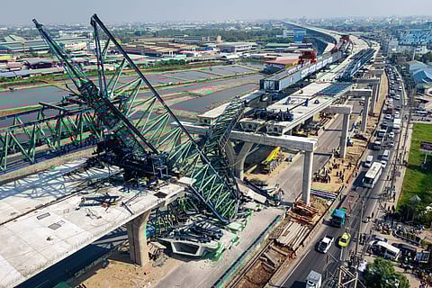 A construction crane that collapsed on the Rama 2 Road elevated expressway in Samut Sakhon province, Thailand, on Thursday, Jan. 15, 2026.