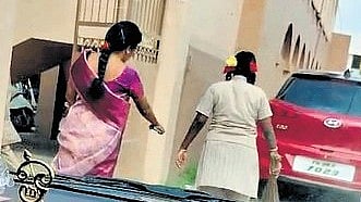 A screengrab of the video showing a student sweeping the road in front of the school on Tuesday.