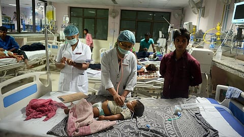 Resident doctors attending to a patient