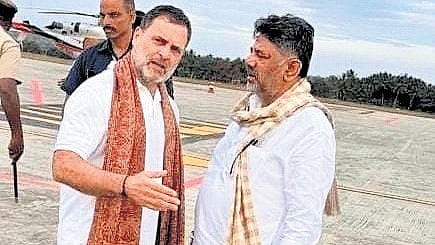 Rahul Gandhi in conversation with DK Shivakumar at the tarmac of  Mysuru airport on Tuesday.