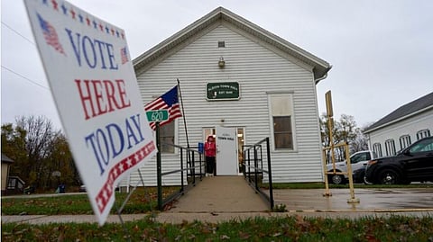 FILE - A voter leaves Albion Town hall after casting their ballot on Election Day, Nov. 5, 2024, in Albion, Wis.
