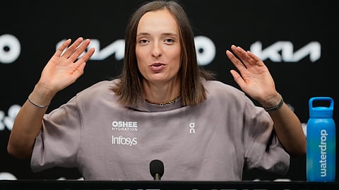Iga Swiatek of Poland reacts during a press conference ahead of the Australian Open tennis championship in Melbourne, Australia, Friday, Jan. 16, 2026.