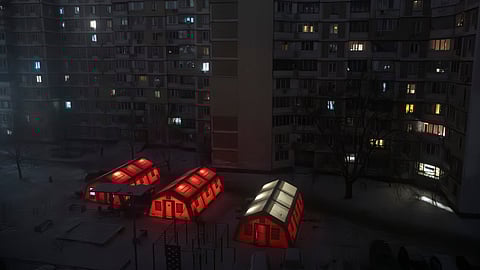 Emergency tents are set up in a residential neighborhood where people can warm up following Russia's regular air attacks against the country's energy objects that leave residents without power, water and heating in the dead of winter, in Kyiv, Ukraine, Thursday, Jan. 15, 2026. 