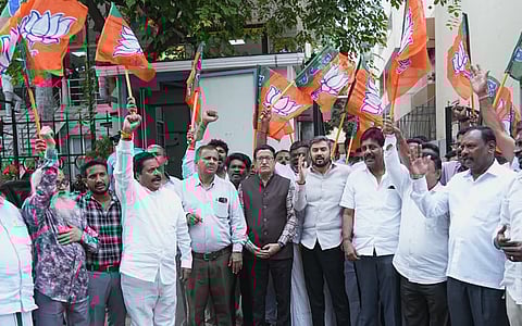 BJP leaders and supporters celebrate for BJP's victory in local body election at Maharashtra, at party office in Bengaluru on Friday .