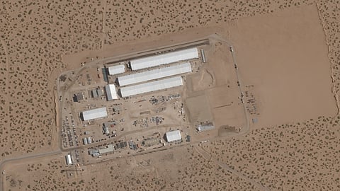 This Aug. 7, 2025, satellite image shows construction of large white tents for a new immigrant detention center at Fort Bliss, a US Army base outside El Paso, Texas.