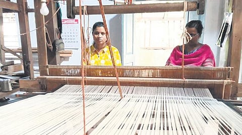 Kamala (L) and Bindu working on a Kuppadam saree
