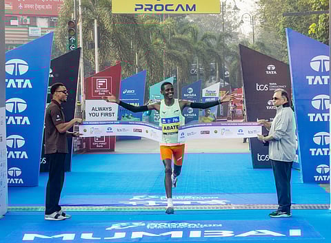 Ethiopia’s Tadu Abate Deme crossed the finish line to win the overall men’s title at the Tata Mumbai Marathon