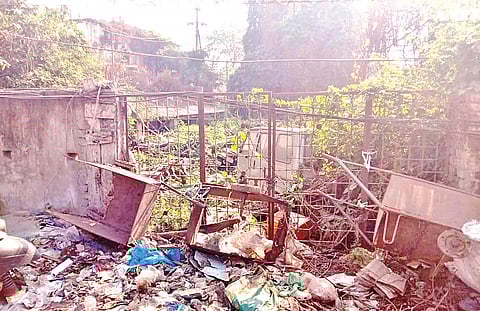 Garbage dumped in the area at the backside of Badambadi police station | Express