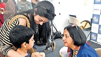 Author Rohini Nilekani interacts with a young participant at Bengaluru Hubba on Saturday.